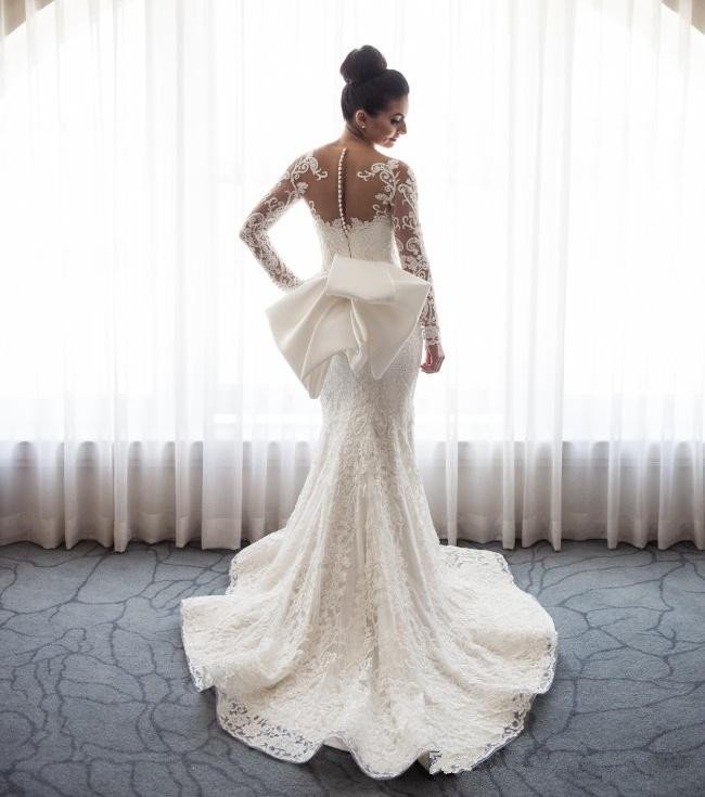 http://www.ballbella.com/cdn/shop/files/amazingmermaid-lace-bowknot-wedding-bride-dress-detachable-overskirt-sleeve-bridal-dress-wedding-dress-3_1024x.jpg?v=1701893826