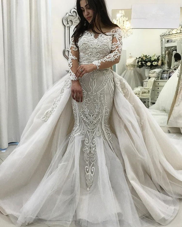 Inspired by this wedding dress at ballbella.com,Mermaid style, and Amazing Lace work? We meet all your need with this Classic AmazingLong Sleeves Lace Mermaid Bridal Gowns Detachable Train  latest Ruffless Bridal Gowns.