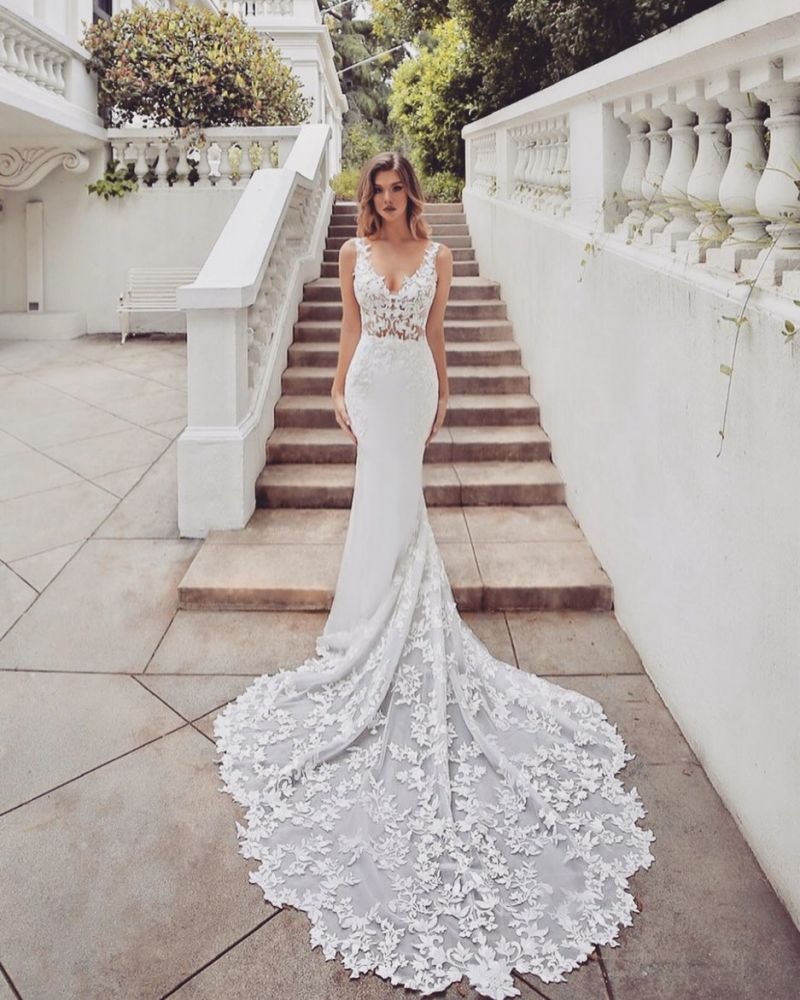 Searching for a dress in lace, Mermaid style, and delicate Lace,Pearls work? We meet all your need with this Classic AmazingTrain Sleeveless V-neck Lace mermaid wedding dresses at factory price.