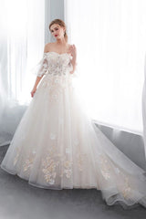 Check this Ball Gown Off-the-shoulder Floor Length Appliques Tulle Wedding Dresses at ballbella.com, this dress will make your guests say wow. The Off-the-shoulder bodice is thoughtfully lined, and the Floor-length skirt with Appliques to provide the airy, flatter look of Satin,Tulle.