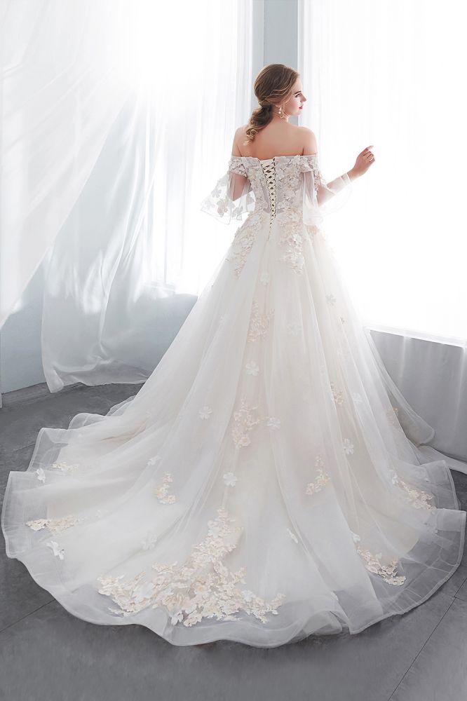 Check this Ball Gown Off-the-shoulder Floor Length Appliques Tulle Wedding Dresses at ballbella.com, this dress will make your guests say wow. The Off-the-shoulder bodice is thoughtfully lined, and the Floor-length skirt with Appliques to provide the airy, flatter look of Satin,Tulle.