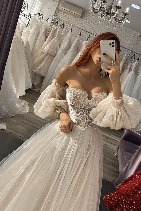 Looking for a dress in Tulle, A-line style, and Amazing Lace,Beading,Appliques,Sequined work? We meet all your need with this Classic Charming Off the Shoulder Puffy Sleeves Aline Tulle Wedding Dress.