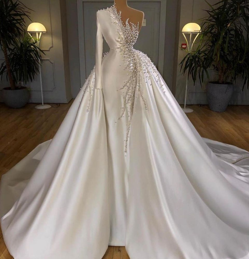 Looking for a dress in Satin, Column,Mermaid style, and AmazingBeading,Pearls work? We meet all your need with this Classic Charming One Shoulder Satin Mermaid Bridal Gowns Pearls Beading Party Gowns.