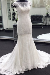 Looking for a dress in Tulle, Mermaid style,and Amazing Lace work. We have all covered on this Classic Cap Sleeves White Illusion neck Lace Mermaid Wedding Dress with Court Train design.