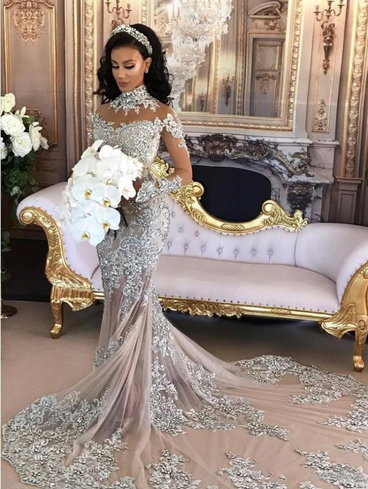 Wanna get a dress in Mermaid style, and delicate Lace,Crystal work? Ballbella custom made you this Classic High neck Long Sleevess Mermaid Wedding Dress Silver Tulle Bridal Gowns with Lace Appliques at factory price.