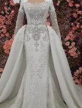 Any idea of dress for your big day? Ballbella custom made you this Classic Long Sleevess Mermaid Wedding Dresses with Overskirt at factory price.