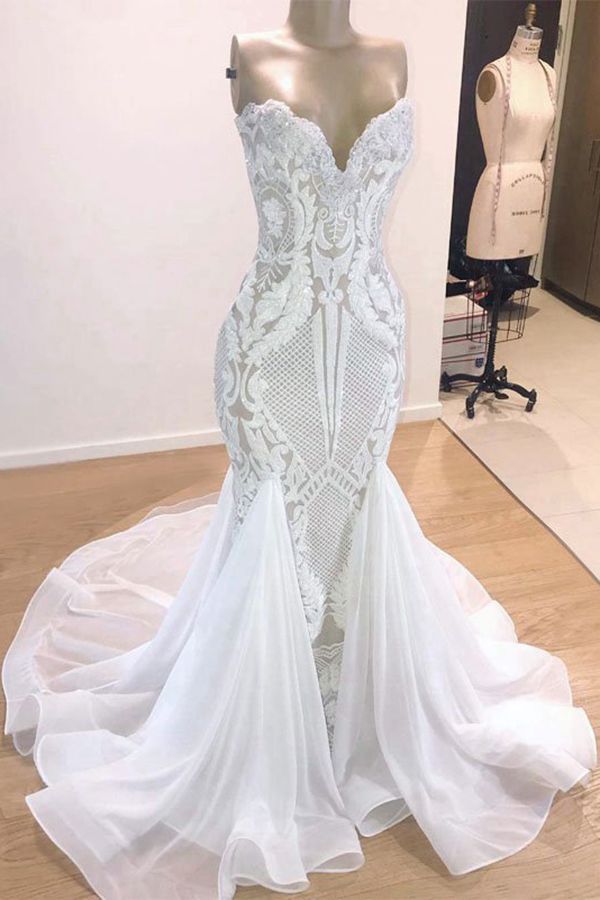 Try this Sparkle Mermaid White Wedding Dress to wow your wedding guests with Ballbella. The Strapless,Sweetheart design and exqusite handwork, and the Floor-length wedding dress with Appliques,Sequined to provide the cool and simple look for summer wedding.