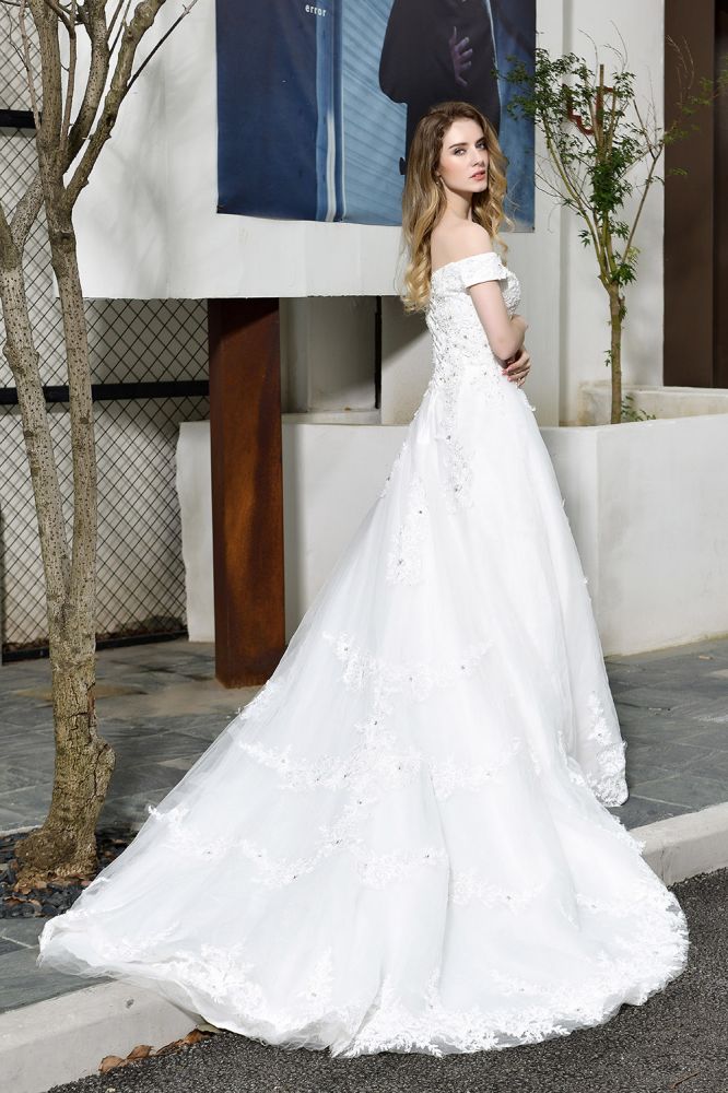 Looking for a perfect dress for your big day. Ballbella has Classic White Lace Off-the-Shoulder Wedding Dress avilable in White, Ivroy and champange. Try this simple bridal gowns for your summer wedding.