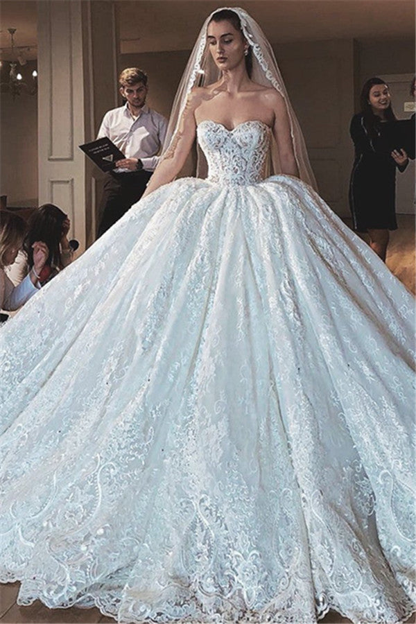Inspired by this wedding dress at ballbella.com,Ball Gown style, and Amazing Lace,Appliques work? We meet all your need with this Classic Glamorous Modern Strapless Lace Appliques Ball Gown Wedding Dress.