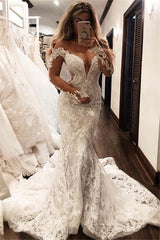 Check this Glamorous Off-the-Shoulder Long Sleevess V-Neck Appliques Mermaid Floor-Length Wedding Dresses at ballbella.com, this dress will make your guests say wow. The V-neck,Off-the-shoulder bodice is thoughtfully lined, and the Floor-length skirt with Appliques to provide the airy, flatter look of .
