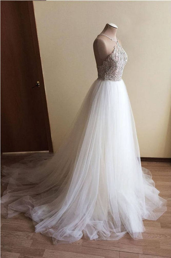 Wanna get a dress in Tulle, A-line style, and delicate Crystal work? We meet all your need with this Classic Halter Illusion neck High split A-line Tulle Princess Wedding Dress at factory price.