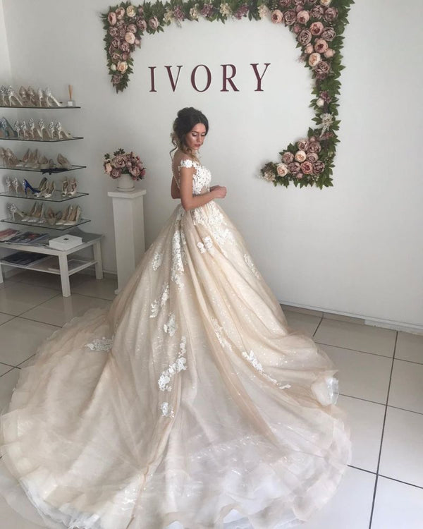 Ballbella offers Ivory V-neck off-the-shoulder Princess Ball Gown Wedding Dress at factory price from White,Ivory,Champagne,Black, Tulle,Lace to A-line Floor-length hem. All sold at reasonable price
