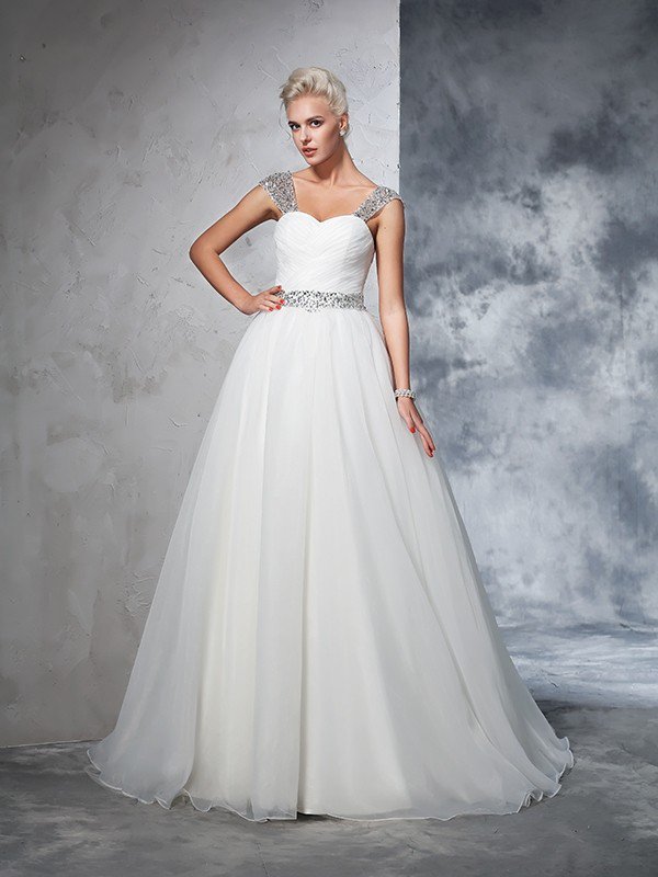 This Long Tulle Ball Gown Straps Ruched Sleeveless Wedding Dresses at ballbella at ballbella.com, this dress will make your guests say wow. The bodice is thoughtfully lined, and the Floor-length skirt with to provide the airy.