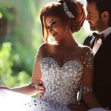 Check out this Luxurious Crystals Beading Long Sleevess Ball-Gown Wedding Dresses at ballbella.com, extra coupons to save you a heap.