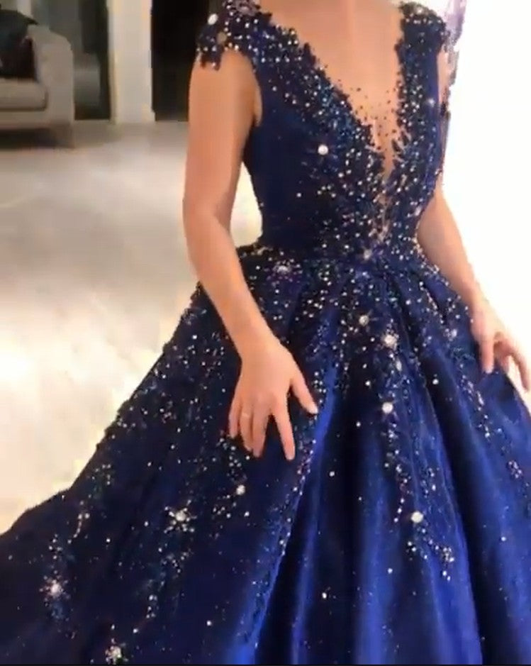 Ballbella offers Luxurious Dark Navy Deep V-neck Cap sleeves Ball Gown with free shipping and custom make services. Be the prom belle in the Sparkle Beaded Prom Dresses. Don't miss it out.