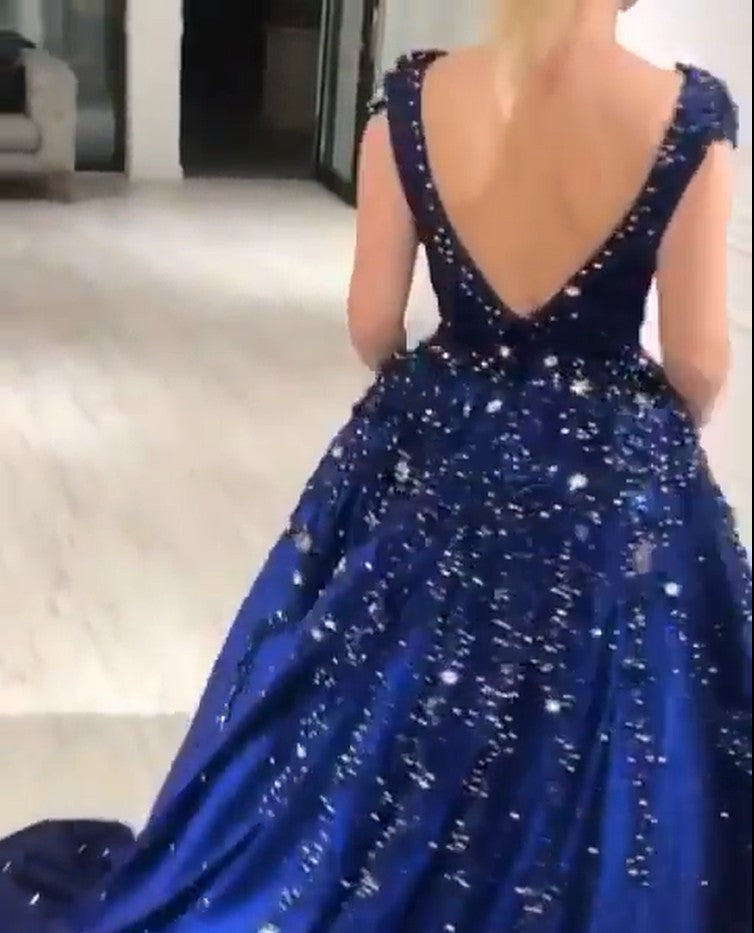 Ballbella offers Luxurious Dark Navy Deep V-neck Cap sleeves Ball Gown with free shipping and custom make services. Be the prom belle in the Sparkle Beaded Prom Dresses. Don't miss it out.
