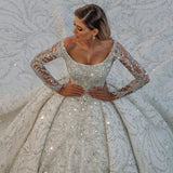 Looking for a dress in Satin, A-line style, and AmazingBeading,Sequined work? We meet all your need with this Classic Luxurious Princess Ball Gown Long Sleevess Sparkly sequins Bridal Gowns with Sweep Train.