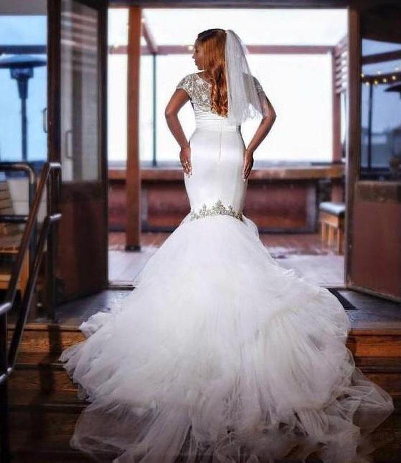 Looking for a dress in Tulle, Mermaid style, and AmazingBeading work? We meet all your need with this Classic Mermaid Tulle Beads Appliques Wedding Dress Exquisite Short Sleeves Bridal Dresses.