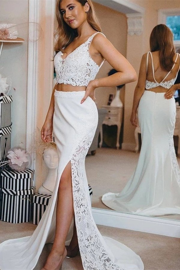 Inspired by this wedding dress at ballbella.com,Mermaid style, and Amazing Lace work? We meet all your need with this Classic Modern two-pieces Spaghetti V-Neck Lace Side Slit Beach Wedding Dress.