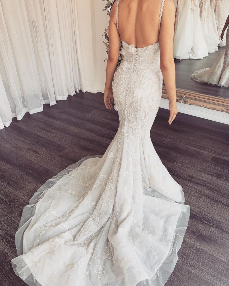Looking for a dress in Lace, Mermaid style, and Amazing Lace work? Ballbella custom made you this Modern V-neck Sleeveless Lace Overskirt Bridal Gowns For Wedding latest.