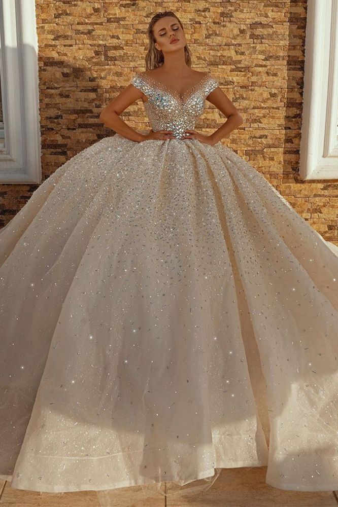Looking for a dress in Satin, A-line style, and AmazingSequined,Rhinestone work? We meet all your need with this Classic Off the Shoulder Crystal Princess Ball Gown Sequins Bridal Gowns.