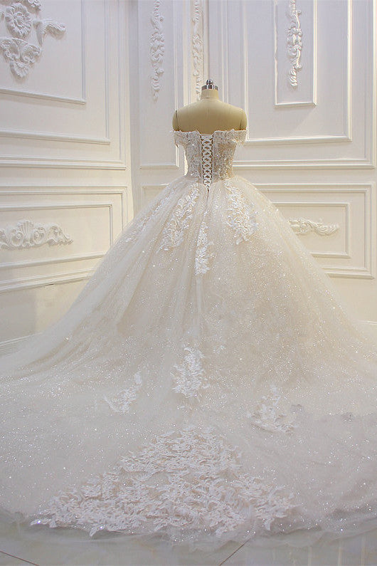 Wanna get a dress in Tulle, Ball Gown style, and delicate Lace,Appliques,Sequined work? We meet all your need with this Classic Off-the-shoulder Tulle Lace Appliques Sequined Wedding Dress at factory price.