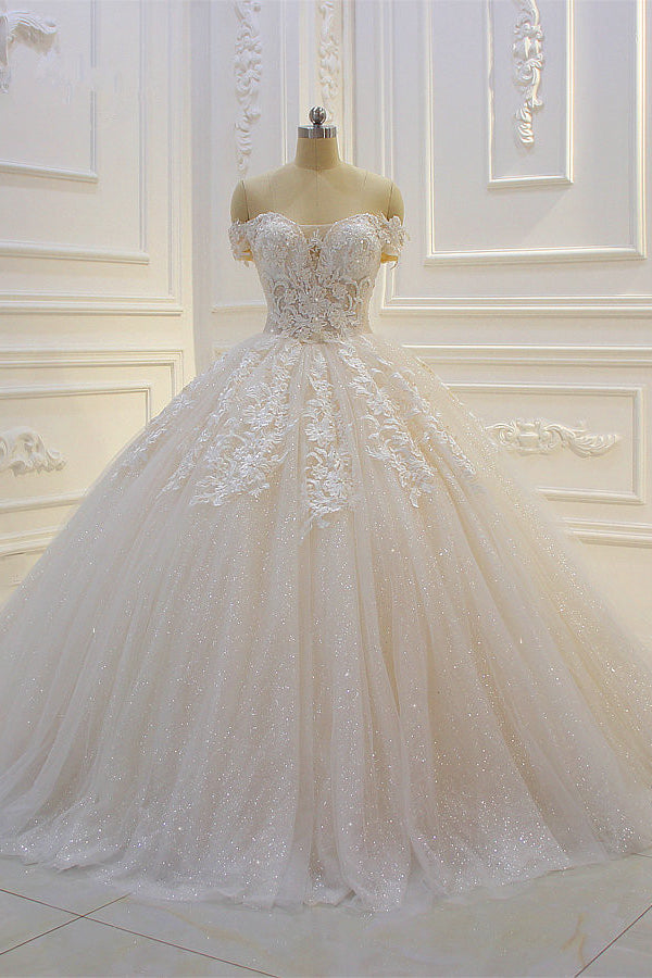 Wanna get a dress in Tulle, Ball Gown style, and delicate Lace,Appliques,Sequined work? We meet all your need with this Classic Off-the-shoulder Tulle Lace Appliques Sequined Wedding Dress at factory price.