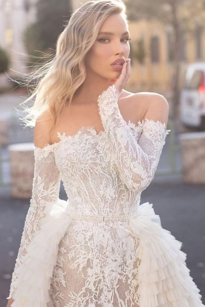 Inspired by this wedding dress at ballbella.com,A-line style, and Amazing work? We meet all your need with this Classic Off the Shoulder Wedding Gown Long Sleeves Floral Mermaid with Detachable Train.