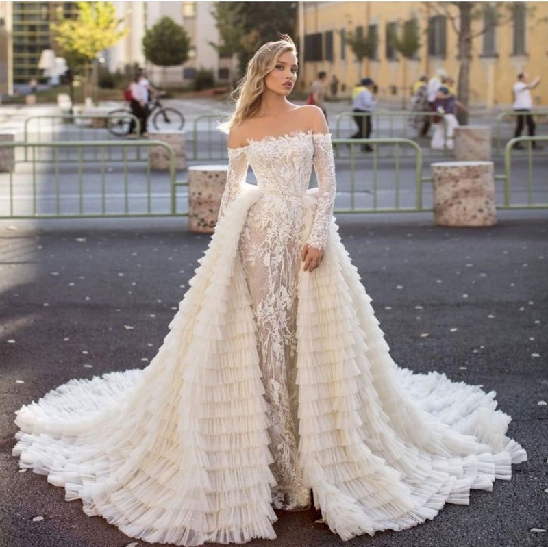Inspired by this wedding dress at ballbella.com,A-line style, and Amazing work? We meet all your need with this Classic Off the Shoulder Wedding Gown Long Sleeves Floral Mermaid with Detachable Train.