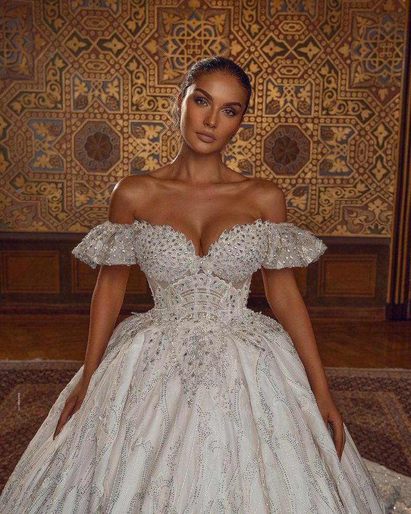 Looking for a dress in Satin,Tulle, A-line style, and Amazing Crystal,Rhinestone work? We meet all your need with this Classic Off-the-ShoulderAline Ball Gown Wedding Dress Floral Lace.