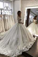 Looking for a dress in Tulle, A-line style, and Amazing Lace work? We meet all your need with this Classic Romantic Off-the-ShoulderLace Ball Gown White Spring Bridal Gown Long Sleevess.