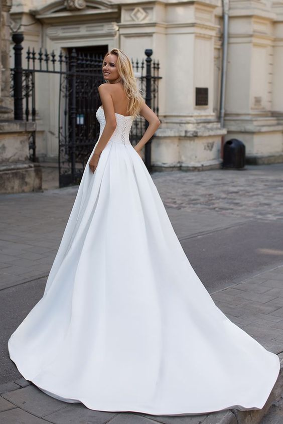 Ballbella custom made you this Simple Strapless White A-line Zipper up A-line Princess Wedding Dress comes in all sizes and colors.Fast delivery worldwide.