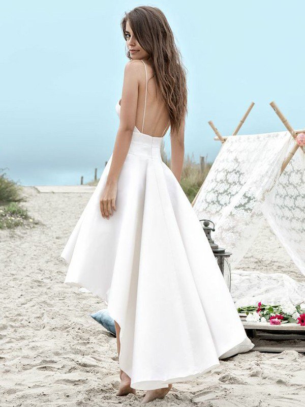 Check out This beautiful Sleeveless Spaghetti Straps Ruched Wedding Dresses at ballbella.com, this dress will make your guests say wow. The Spaghetti Straps bodice is thoughtfully lined, and the Asymmetrical skirt with Ruched to provide the airy, flatter look of Satin.