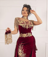 Ballbella offers Sleeveless Velvet Burgundy Mermaid Prom Party GownsTassel Gold Appliques Evening Gown with Front Split at a good price from Velvet to Mermaid hem. Gorgeous yet affordable Sleeveless Prom Dresses, Evening Dresses.