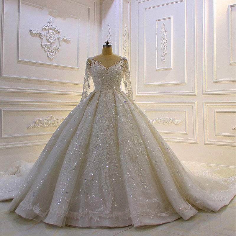 Finding a dress in Tulle, Ball Gown style, and delicate Lace,Beading,Appliques work? Ballbella custom made you this Sparkle 3D Lace Appliques Long Sleevess Church Train Wedding Dress at factory price.