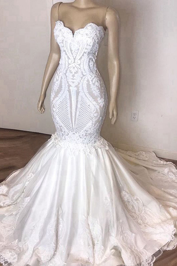 Try this Stunning Strapless Mermaid White Beach Wedding Dress to wow your wedding guests with Ballbella. The Strapless,Sweetheart design and exqusite handwork, and the Floor-length wedding dress with Lace,Appliques to provide the cool and simple look for summer wedding.