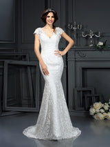 This V-neck Mermaid Sleeveless Lace Long Wedding Dresses at ballbella at ballbella.com, this dress will make your guests say wow. The V-neck bodice is thoughtfully lined, and the Floor-length skirt with Lace to provide the airy, flatter look of Lace.