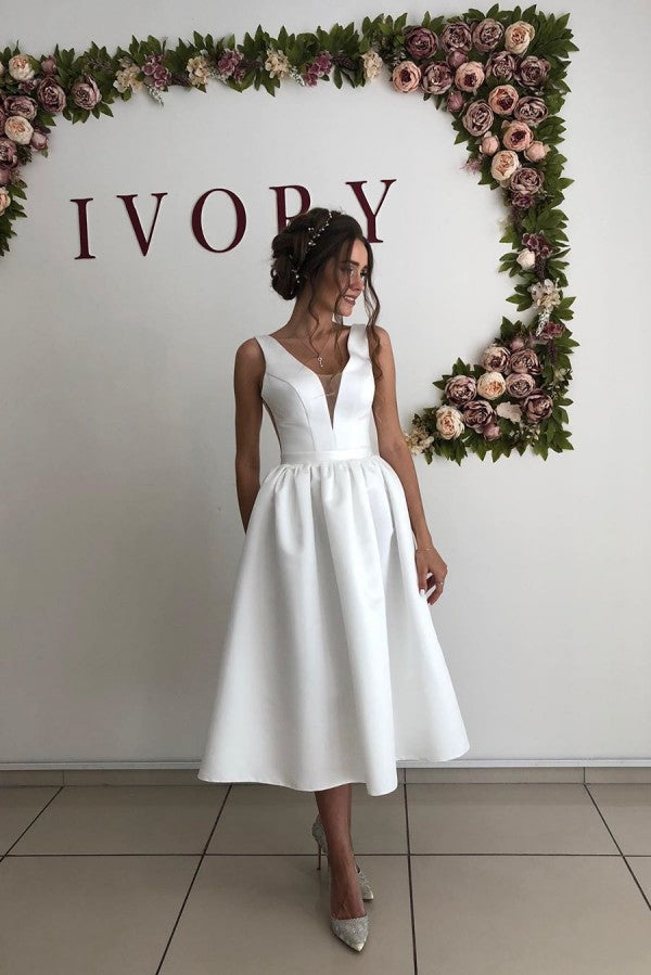 Ballbella offers V-neck White Pleats Sleeveless Short Summer Beach Wedding Dresses online at an affordable price from Satin to A-line Tea-length skirts. Shop for Amazing collections for your bridal party.