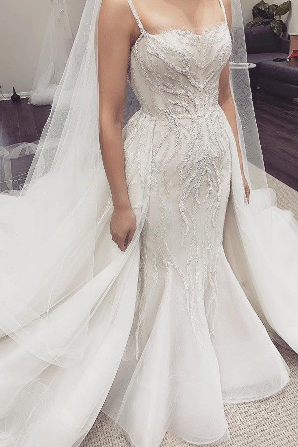 Looking for a dress in Tulle,Lace, Mermaid style, and Amazing Lace work? Ballbella custom made you this White Illusion neck White Sleeveless Mermaid Wedding Dress with Overskirt.